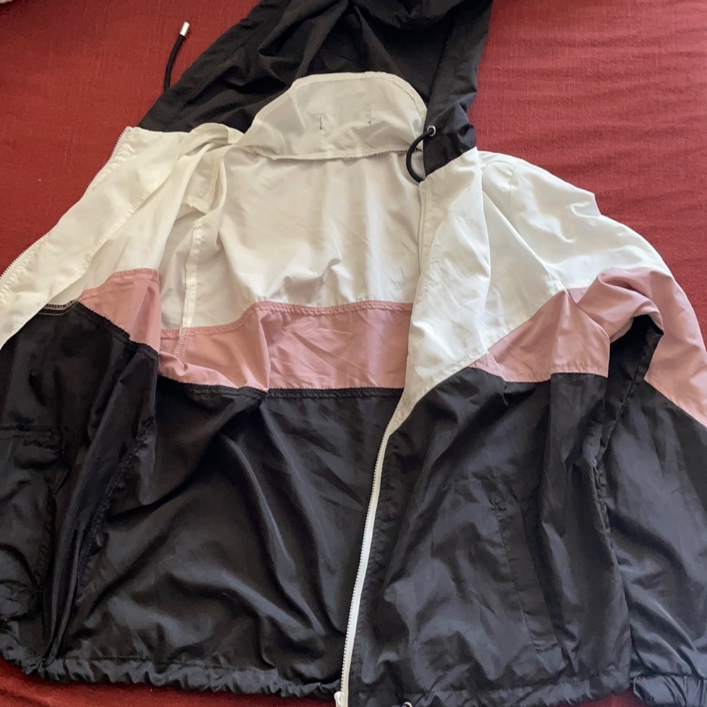 Thin windbreaker. Perfect for layering under jackets. Size S.